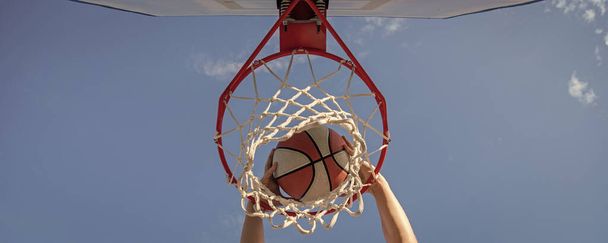 basketball ball dunk through net ring with hands, winning. - Foto, Bild