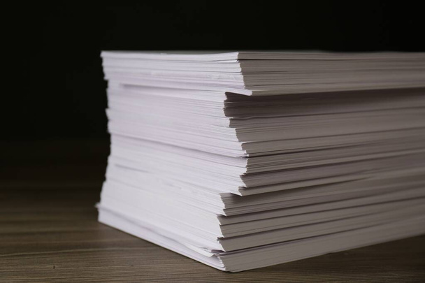 Stack of paper sheets on wooden table, closeup - Fotó, kép