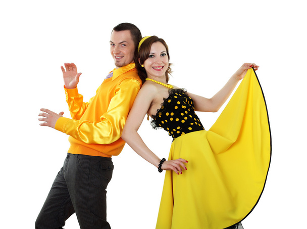 Young dancing couple in bright colour wear - Fotó, kép