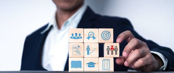 a wood blog with icon Concept of job search, headhunting, recruiting procedure. there are icons for talents, education, qualification, interview, and application. Automation of hiring human resource - 写真・画像