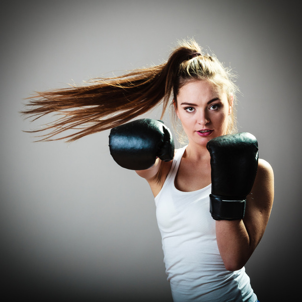 Woman in black gloves boxing - Фото, изображение