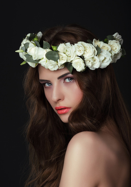Luxurious Woman in Chaplet of Fresh Flowers - Photo, image