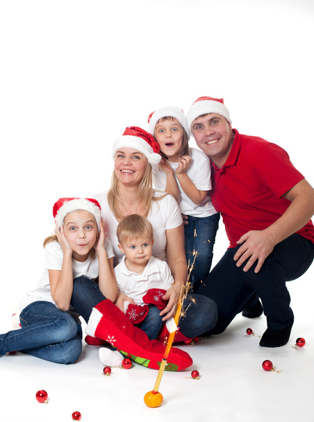 Happy cute family in santa's hats - Фото, изображение