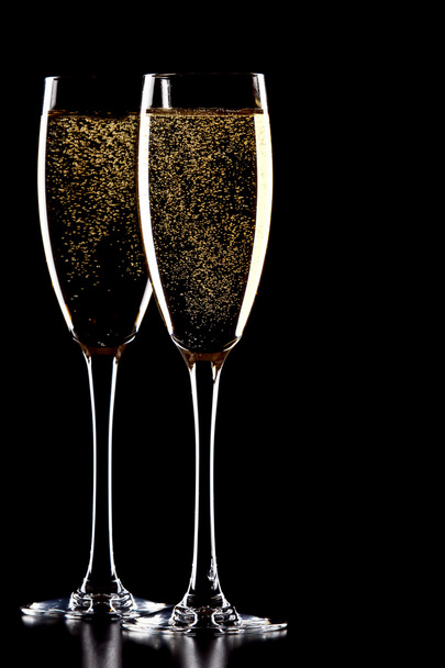 A glass of champagne, isolated on a black background. - Photo, Image