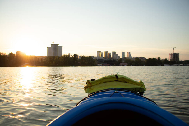 View from a kayak to the coast of the city of Dnepr in Ukraine, a kayak on the Dnieper river in summer - 写真・画像