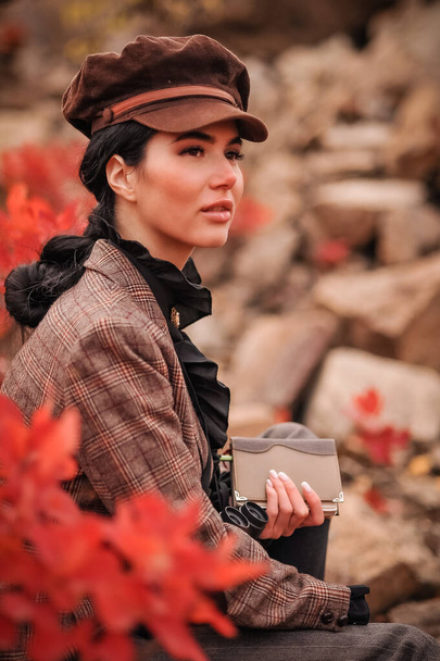 young woman in autumn coat with a hat - Фото, изображение