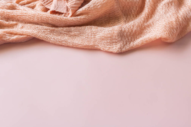 Pink cardigan on the pink background with copyspace. - Photo, image