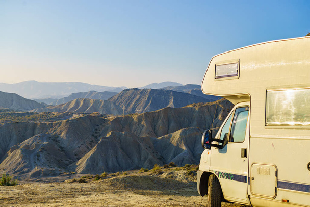 Caravan vehicle camping in Tabernas desert. Almeria province, Andalusia Spain. Traveling with mobile home. - Fotó, kép