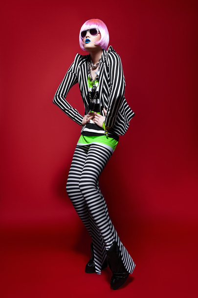Woman in a striped suit - Φωτογραφία, εικόνα