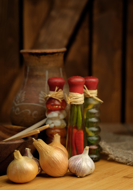 Onions and garlic on a wooden table.  - Foto, Imagen