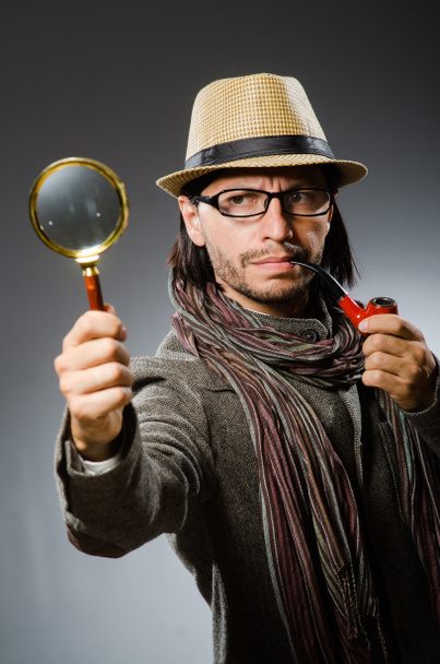 Funny detective with smoking pipe and magnifying glass - Photo, Image