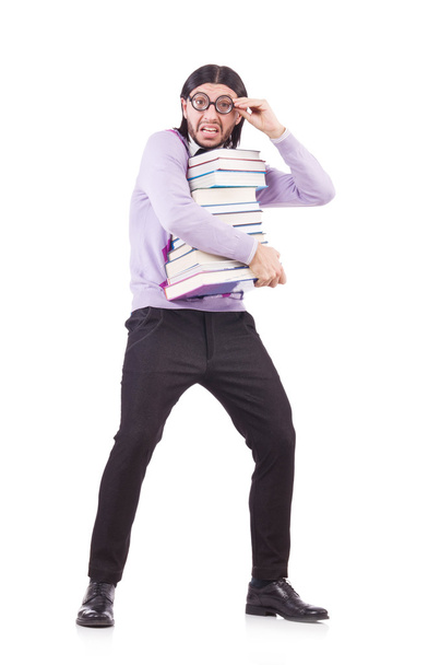 Смешной студент с книгами, изолированными на белом - Фото, изображение