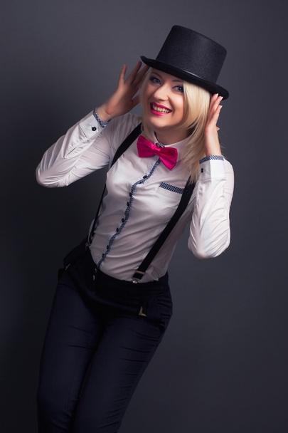 Woman wearing top hat and bow tie - Photo, Image