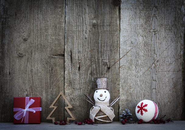 Decorações de Natal em fundo de madeira rústica
 - Foto, Imagem