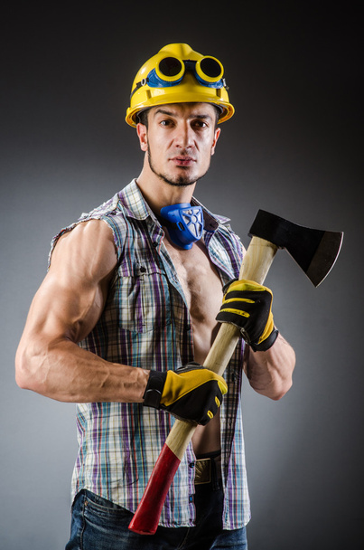 Ripped muscular builder man with tools - Фото, зображення