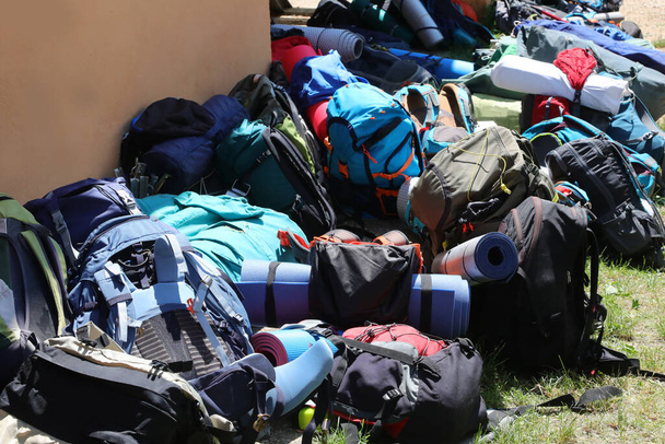 heap of many backpacks used by travelers during their traveling camping around the world - 写真・画像