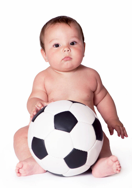 Baby playing with soccer ball. All on white background - Fotó, kép