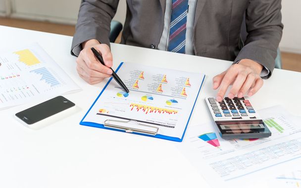 Businessman analyzing report, business performance concept - Photo, Image