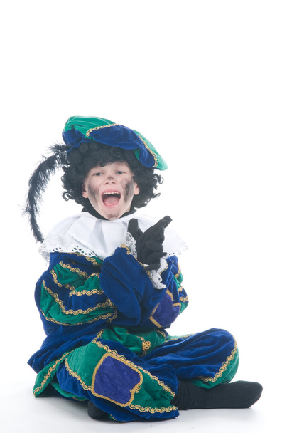 Child playing Zwarte Piet or Black Pete - Фото, изображение