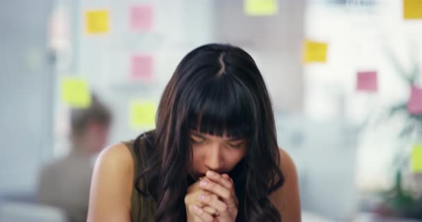 4k video footage of an attractive young businesswoman suffering with a cough while standing in a modern office. - Filmmaterial, Video
