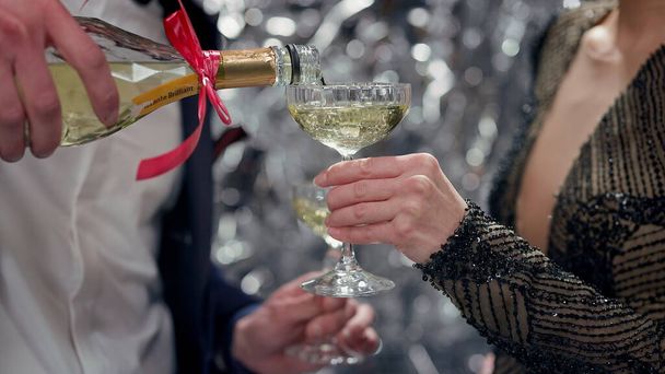 Girl Holding Glass. Man Pours Champagne. Man In Suit. Face Invisible. Party. Romantic Evening. - Fotó, kép