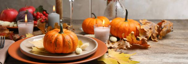 Beautiful autumn place setting and decor on wooden table. Banner design - Photo, Image