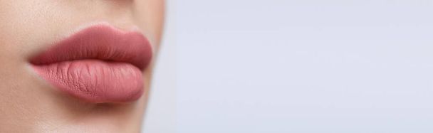 Woman with beautiful lips on light background, closeup view with space for text. Banner design - Foto, Bild