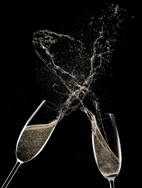 Champagne flutes on black background - Foto, imagen