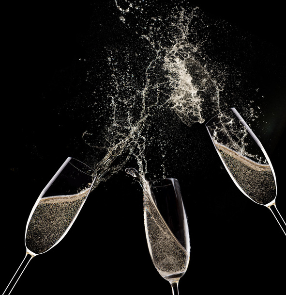 Champagne flutes on black background - Foto, imagen