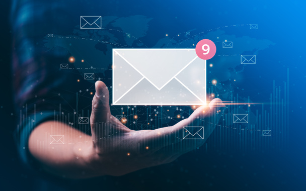 email marketing concept. businessman hand holding envelope or email icon global digital business network. electronic mail, e-commerce. newsletter email, Sending data, access to information - 写真・画像