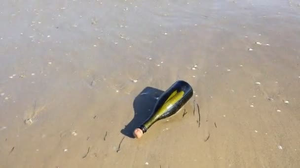 bottle with a secret message carried by the waves of the sea - Footage, Video
