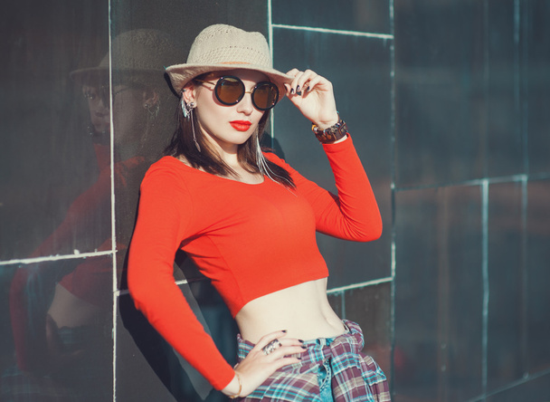 Young beautiful girl in hat and sunglasses enjoy sunlight  - Photo, Image