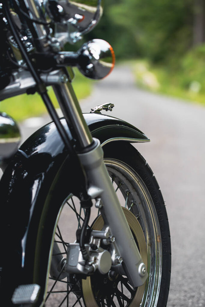 Motorcycle detail closeup front fork and wheel. Travel and sport, speed and freedom concept - 写真・画像