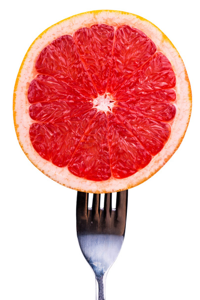 Grapefruit op een vork - Foto, afbeelding