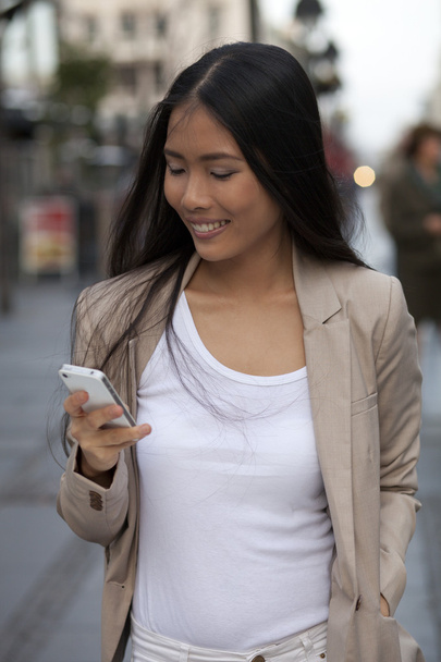 Young business women with cell phone - Photo, Image