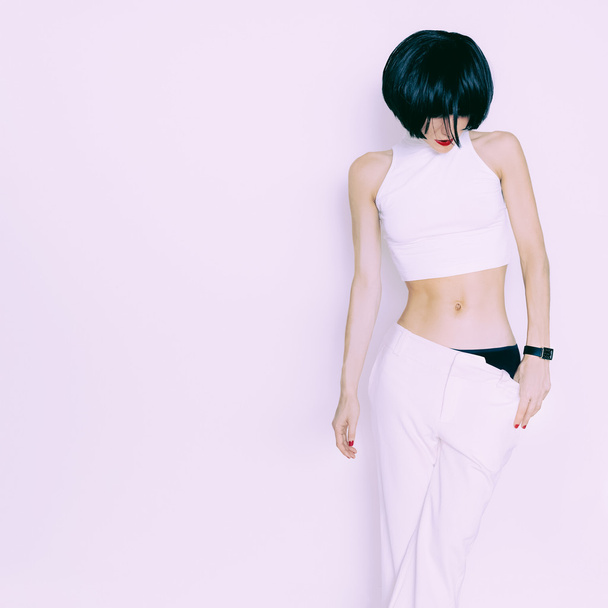 Sensual brunette model on white background in white clothing - Фото, зображення