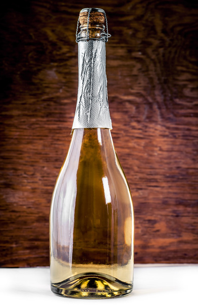 Closed bottle of sparkling wine  - Fotó, kép