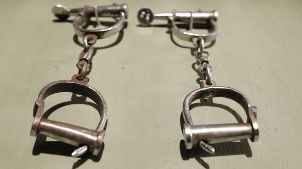Police Handcuffs Hanging on the wall - Photo, Image