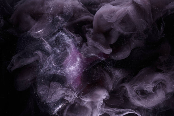 Liquid fluid art abstract background. Pink dancing acrylic paints underwater, ocean space smoke - Фото, зображення
