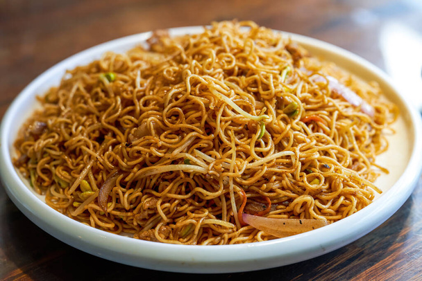 A plate of delicious Hong Kong style fried noodles with soy sauce - Φωτογραφία, εικόνα