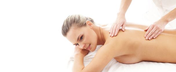 Young, beautiful and healthy woman in spa salon. Traditional massage therapy and skin care treatments. Healthcare and recreation concept. - Foto, Bild