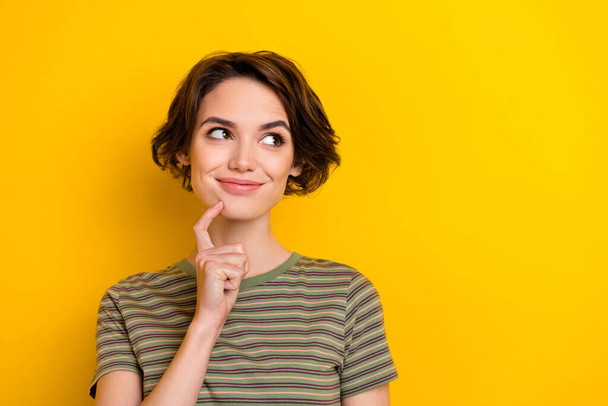 Closeup photo of young thoughtful attractive girl looking empty space make some fun isolated on bright yellow color background. - Фото, изображение