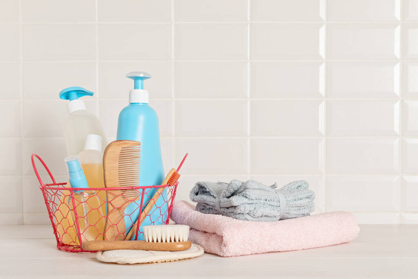 Set of baby toiletries, child organic hygiene and bath accessories, shower gel, shampoo, essential oil, towel in the bathroom - Фото, изображение