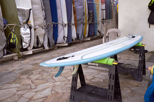 Surfboard storage racks on Waikiki Beach on the island of Oahu, Hawaii. Waxed and ready to go. - Фото, зображення