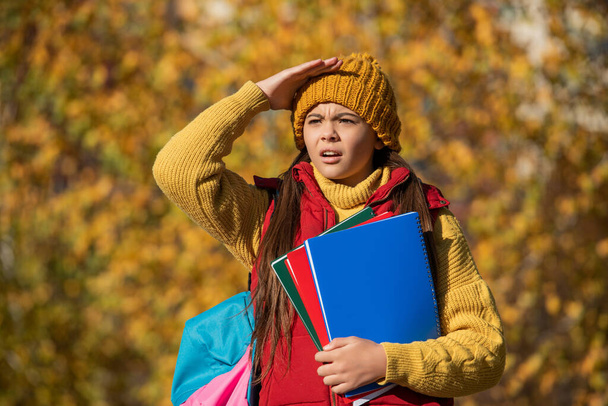 worried teen girl back to school in autumn. - Φωτογραφία, εικόνα