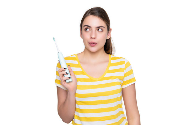 funny young woman with electric toothbrush isolated on white background. - Fotó, kép