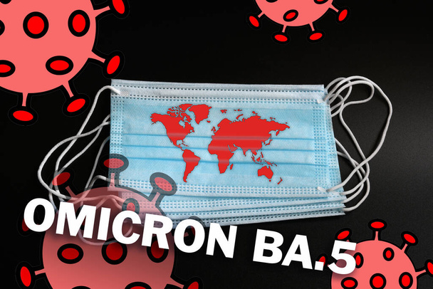 earth map on the protection mask along with coronavirus and Omicron BA.5 text. Dramatic increase in infections due to the new variant Omicron BA.5 of the SARS-CoV-2 virus. - Photo, image