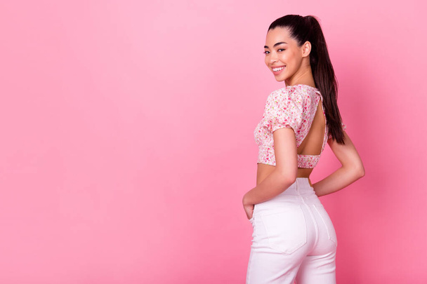 Rear behind portrait of cheerful stunning person toothy smile empty space isolated on pink color background. - Foto, Imagem