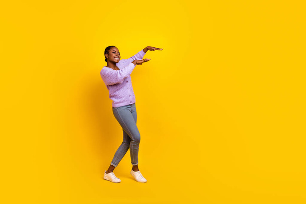 Full length photo of carefree cheerful person have fun dancing partying isolated on yellow color background. - 写真・画像