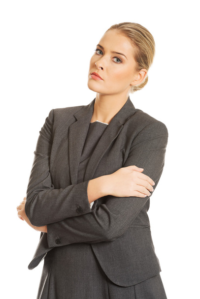 Businesswoman standing in confident pose - Фото, изображение